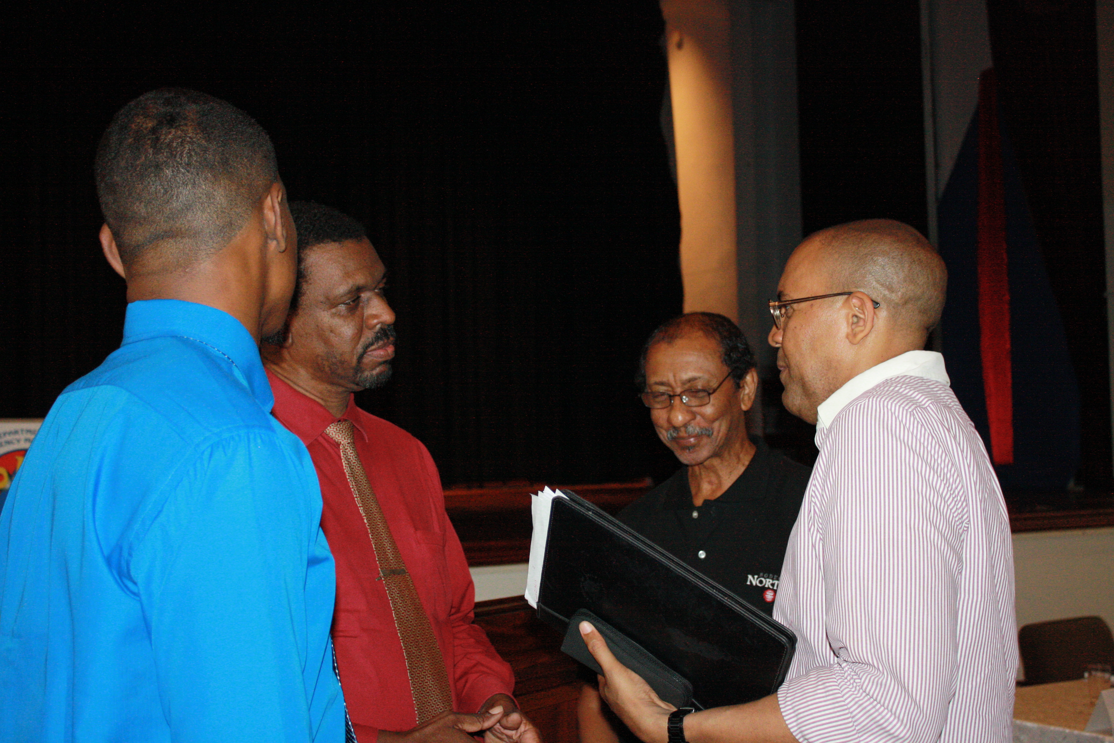 Hon. Kerrie Symmonds chats with Stalwart Awardees